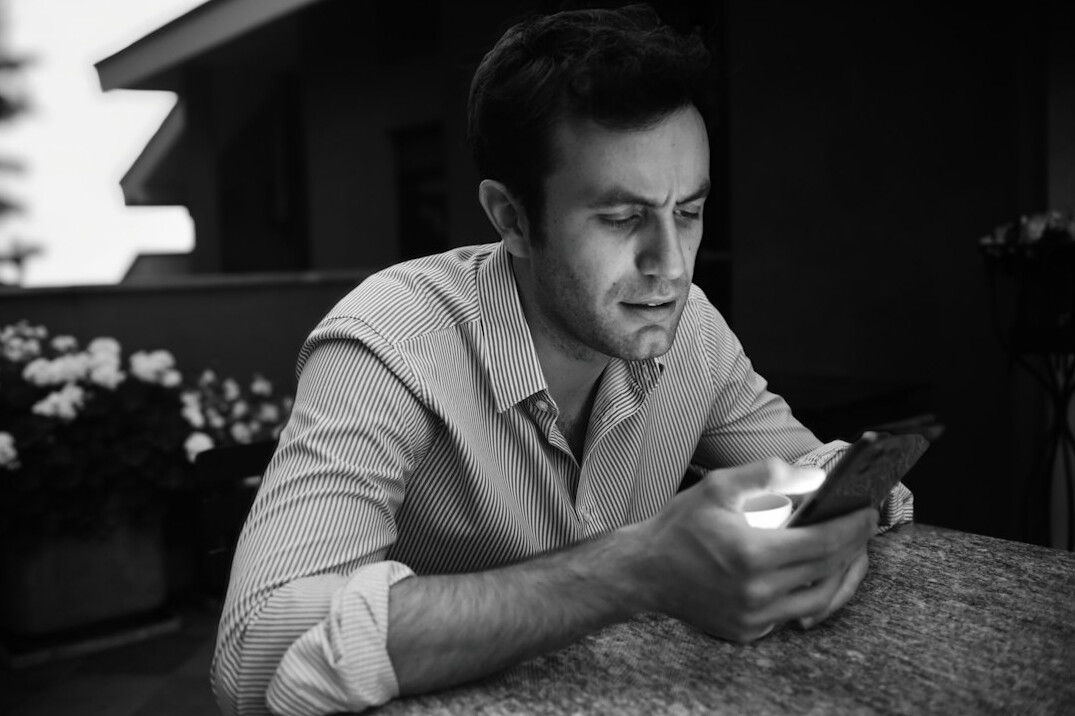Studio portrait of a Portuguese man data journalist in his thirties