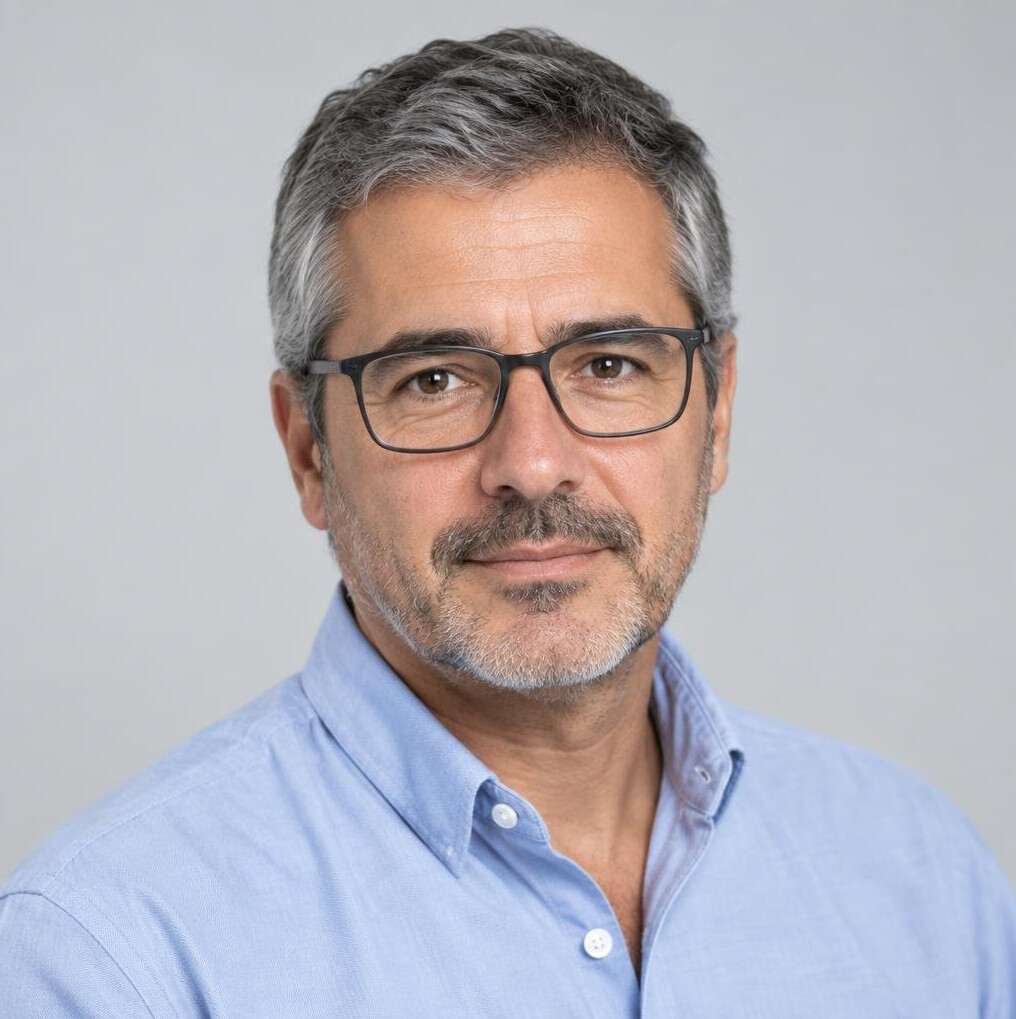 Studio portrait of a Portuguese man journalist in his forties